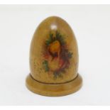 A Victorian Mauchline ware thimble holder of domed form with foliate decoration. With a silver
