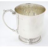 A silver christening mug / tankard, hallmarked Birmingham 1941, maker Adie Brothers Ltd. Approx. 3