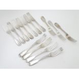 A set of fourteen Victorian Fiddle and Thread pattern table forks with engraved armorial to