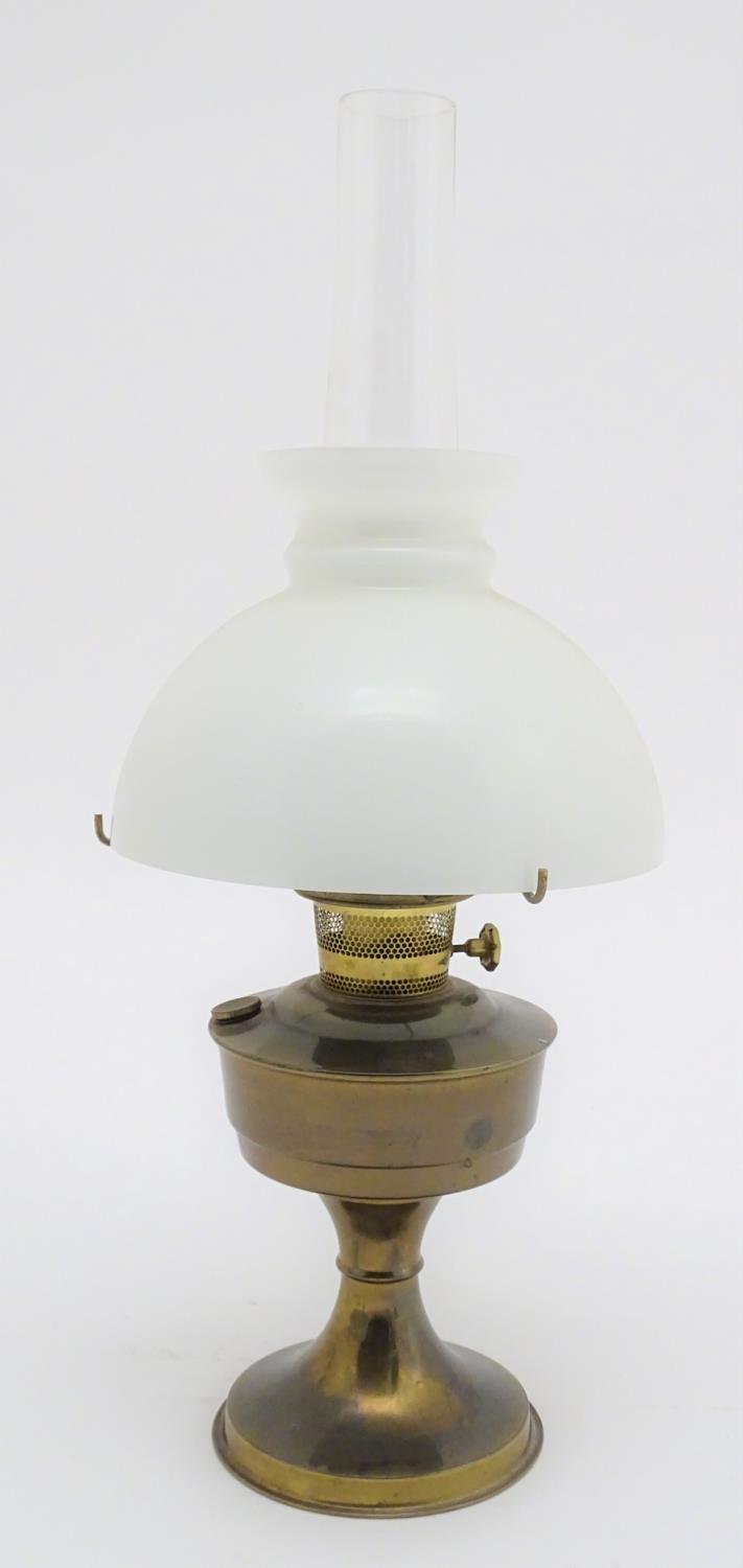 A 20thC oil lamp with a milk glass shade. Approx. 24 1/4" overall. Please Note - we do not make - Image 5 of 9