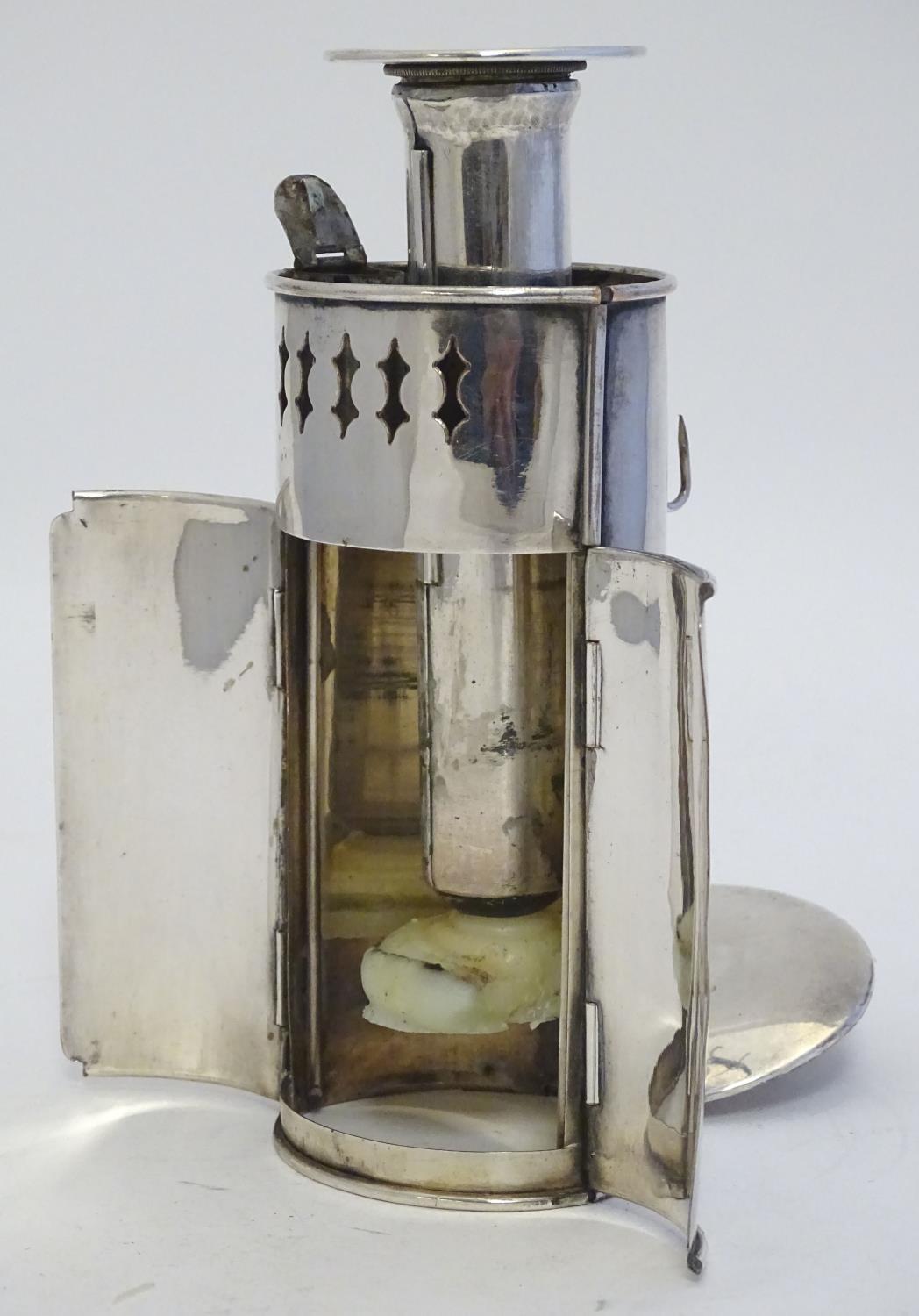 A 19thC silver plate travelling candle lantern with pierced decoration and double doors. Contained - Image 11 of 23