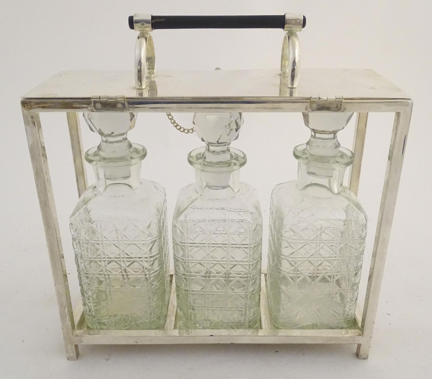 A Dr Christopher Dresser style tantalus with provision for three decanters. Approx. 11 1/2" high - Image 2 of 27