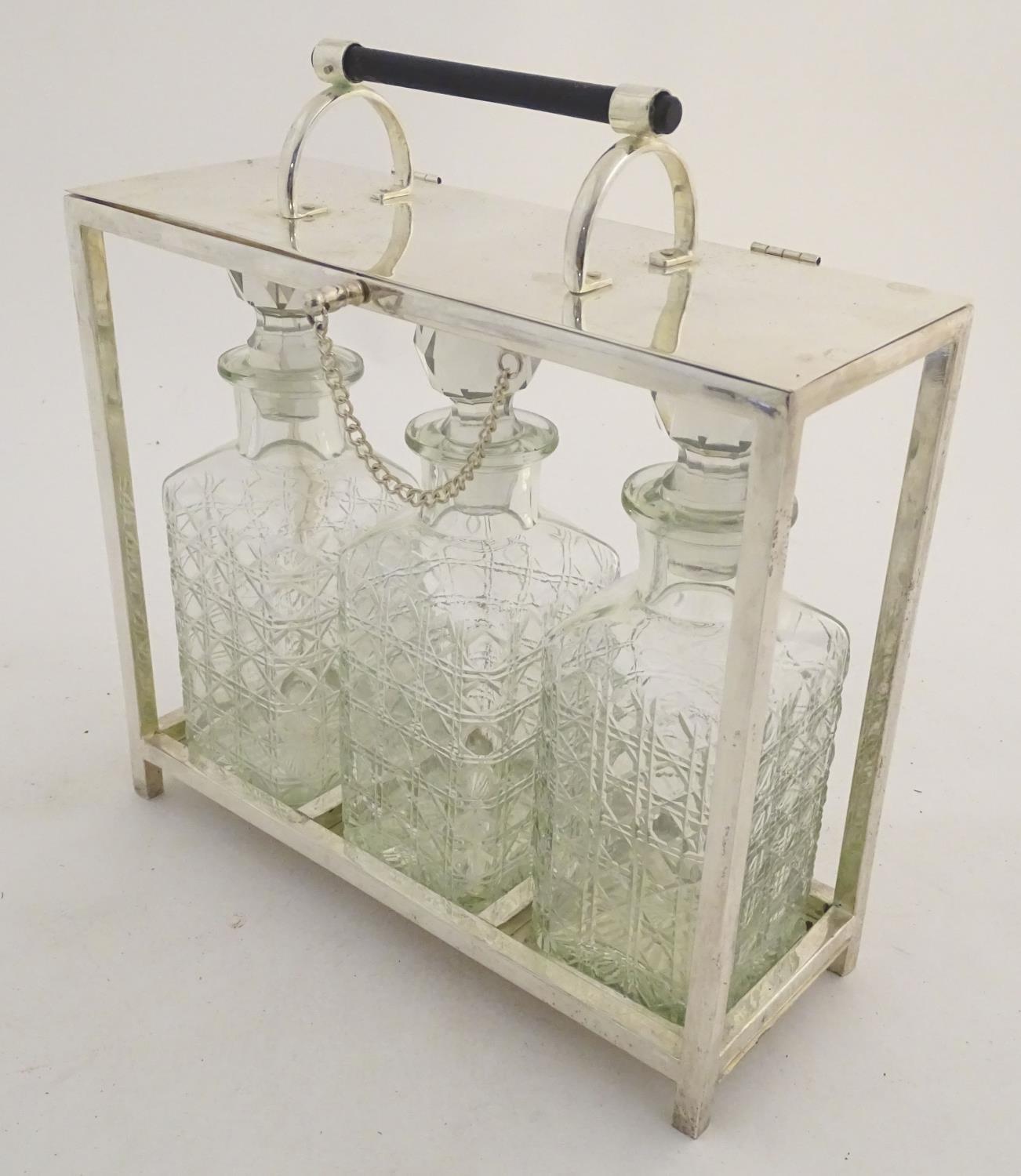 A Dr Christopher Dresser style tantalus with provision for three decanters. Approx. 11 1/2" high - Image 8 of 27