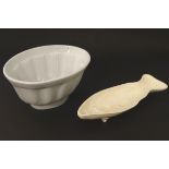 A Leedsware Classical Creamware jelly / mousse mould raised on three feet in the form of a fish,