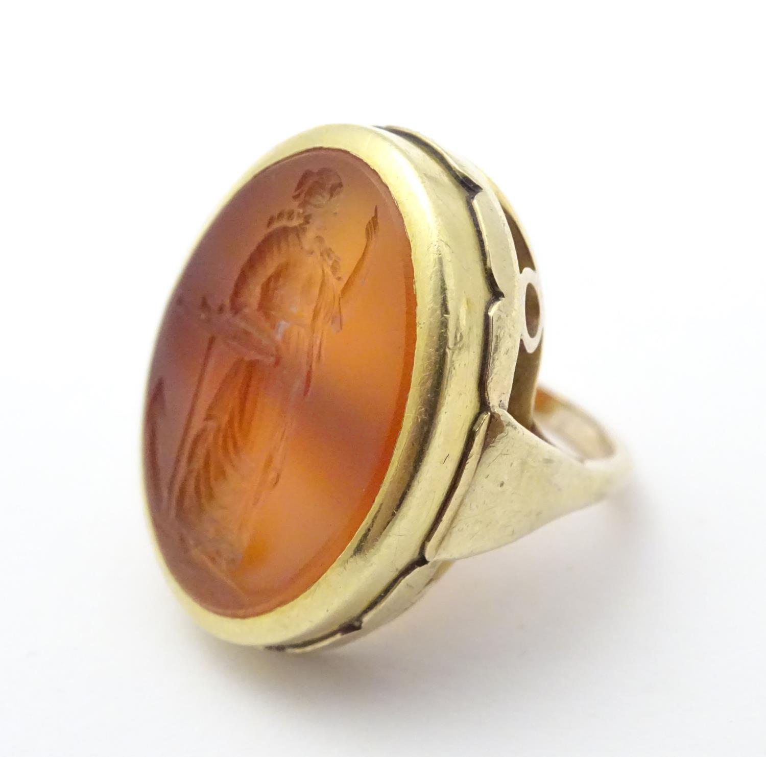 A 9ct gold signet ring set with large carved carnelian seal to centre depicting the personification - Image 5 of 17