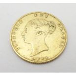 An 1853 gold Victoria half sovereign coin. Approx. weight 4g Please Note - we do not make