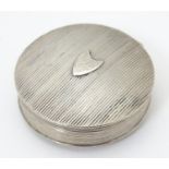 A Continental silver box of circular form. Marked with Dutch marks. 1 3/4" diameter Please Note - we