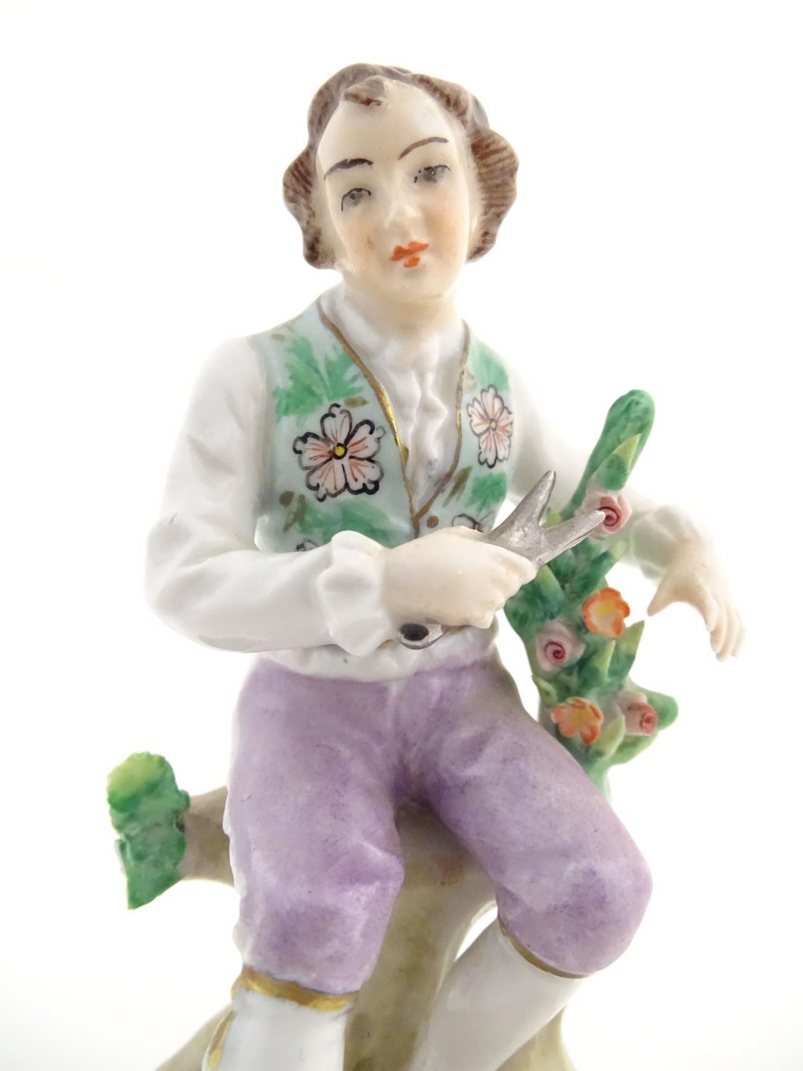 A pair of German Sitzendorf porcelain florist figures, a gentleman and lady, each seated on a - Image 15 of 20