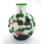 A late-19thC Peking glass scent bottle, decorated with trailing vines and flowers, 3" tall Please