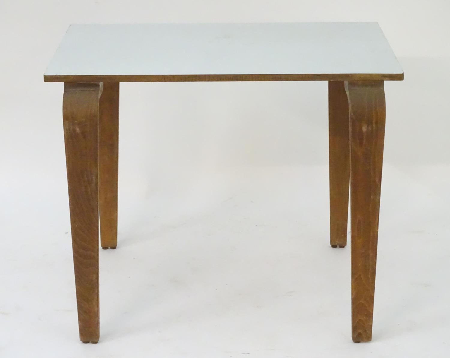 A mid 20thC table with a rectangular top above shaped tapered oak legs. 36" long x 24" wide x 29" - Image 4 of 13