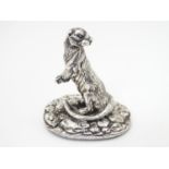 A Silver model of an otter on a naturalistic base. Hallmarked Sheffield 1996, maker Camelot