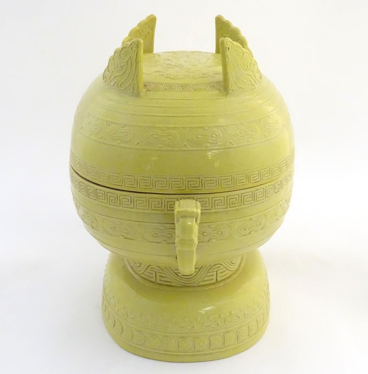 A Chinese yellow ground lidded pot raised on a foot, with twin handles formed as stylised elephant - Image 13 of 32