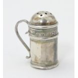 A novelty pepper formed as a miniature flour shaker. Hallmarked Birmingham 1902 maker Sydney