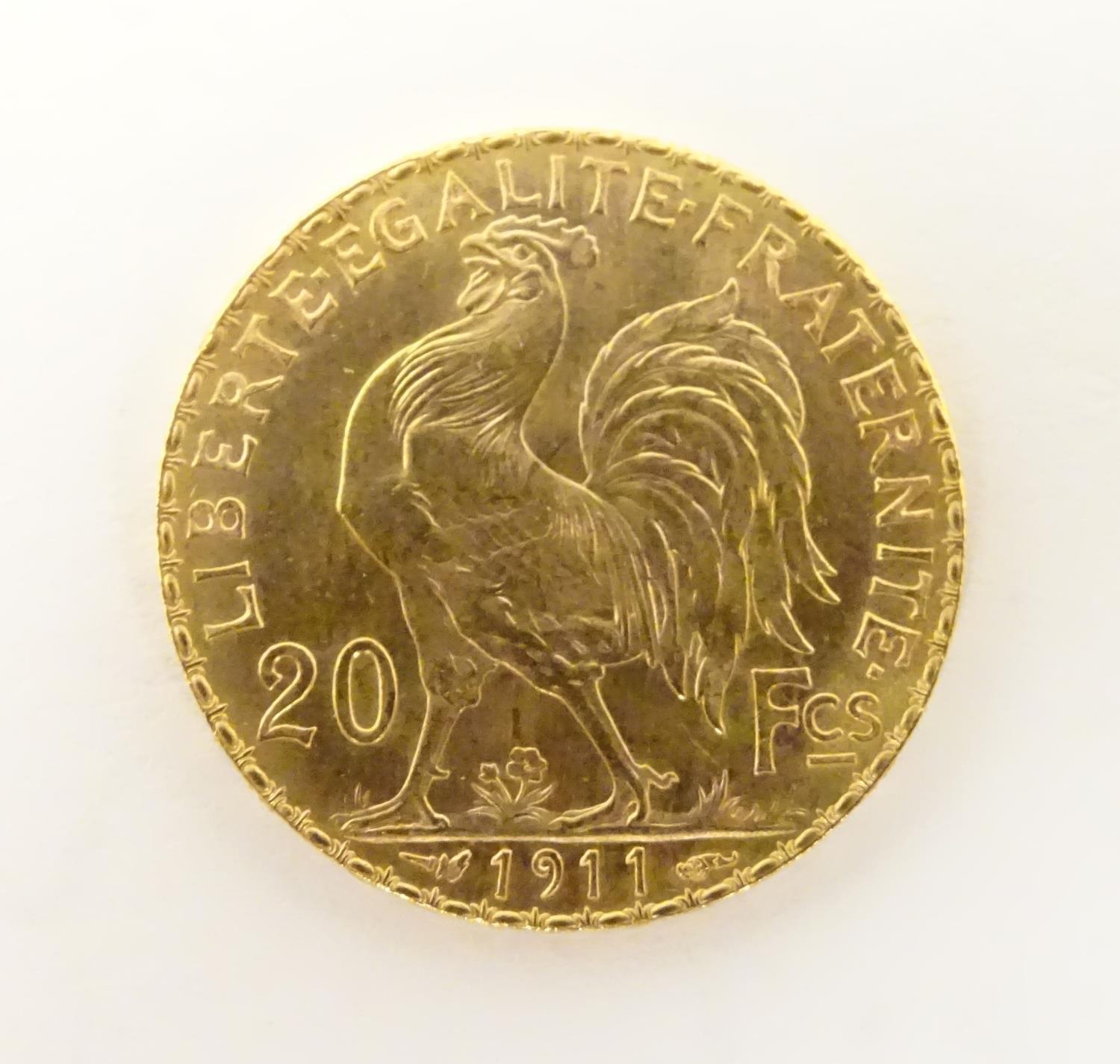 A French Republic 20 franc gold coin, 1911, approx. 6.45g Please Note - we do not make reference