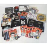 A quantity of 21stC Elvis Presley memorabilia, to include bound magazines, DVD, clock, lap tray,