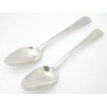 A pair of silver dessert spoons, hallmarked London 1808, maker Thomas Wilkes Barker. Approx. 6 3/