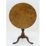 A late 18thC mahogany tripod table with a pedestal base, the circular top above a turned tapering