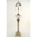 An early-20thC American silver plated and cut glass table lamp, the base formed as a corinthian