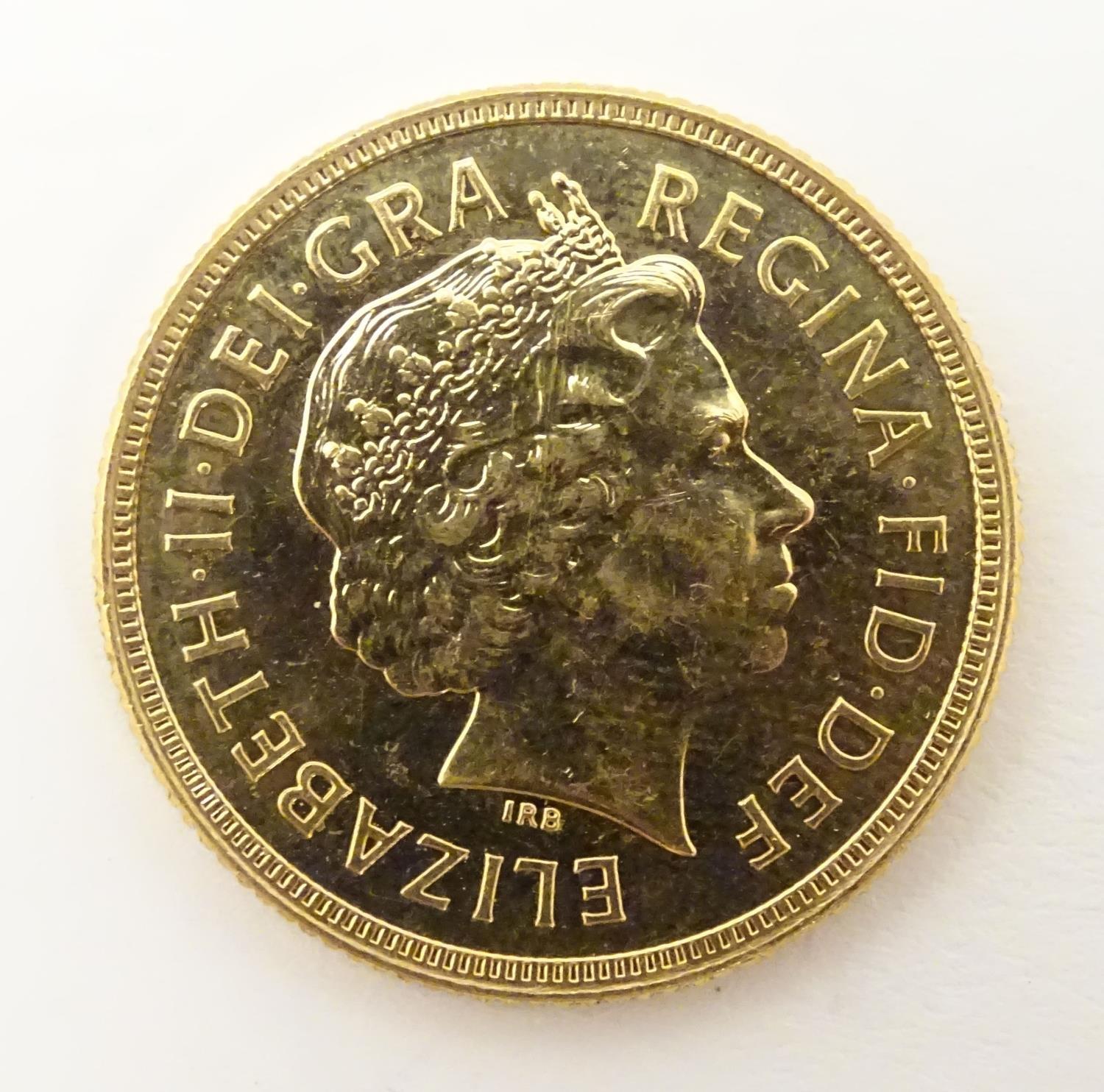 A 2002 gold Elizabeth II sovereign coin. Approx. weight 8g Please Note - we do not make reference to - Image 6 of 10