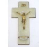 An early 20thC onyx crucifix with a mounted gilt metal Corpus Christi and a small glass holy water