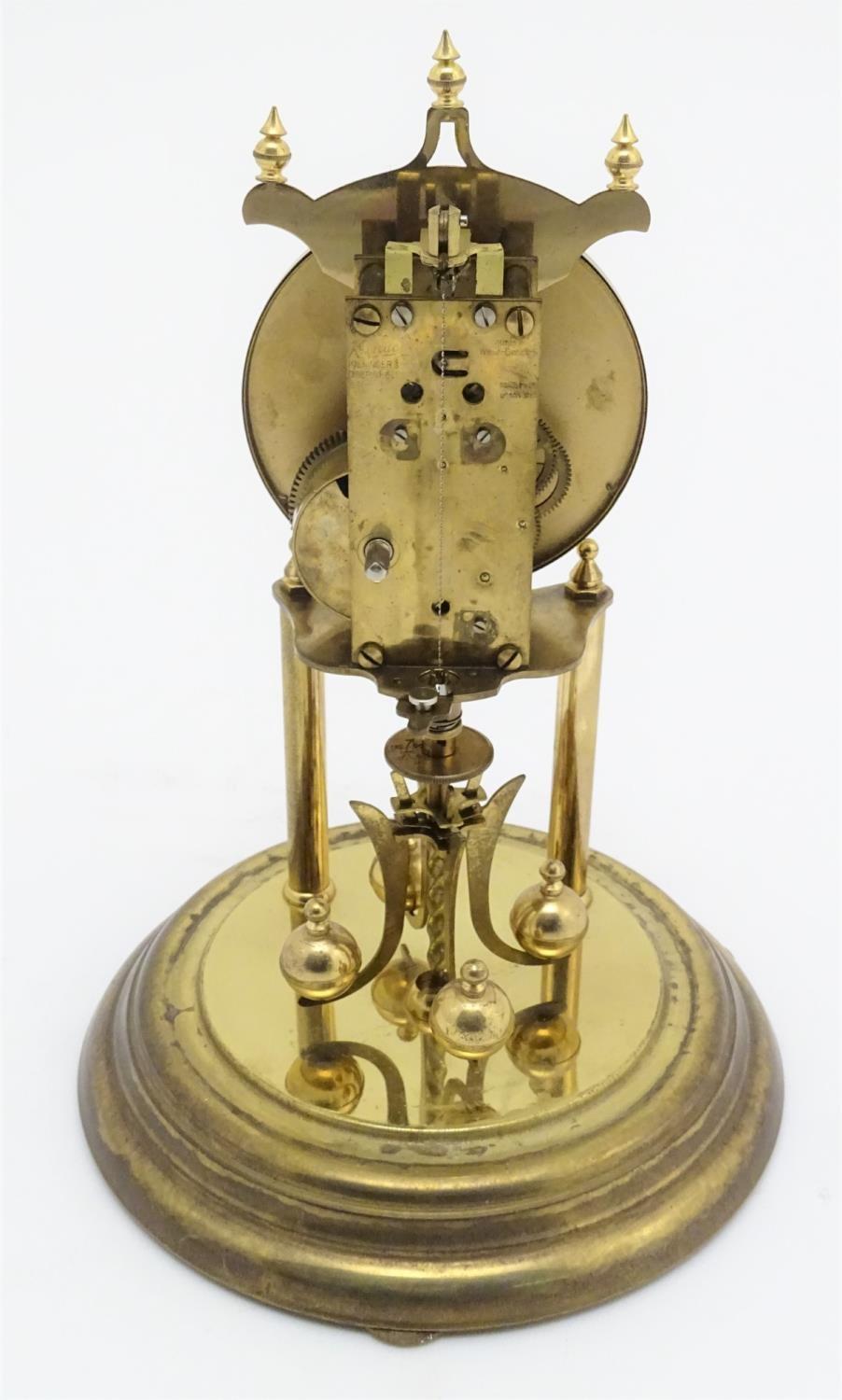 A mid 20thC 'Kundo' anniversary clock with a glass dome above a brass frame. 12" high. Please Note - - Image 9 of 13