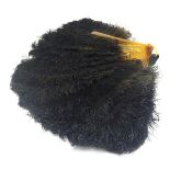 An early 20thC ostrich feather fan, with 18 sticks, the front stick with white metal detail set with