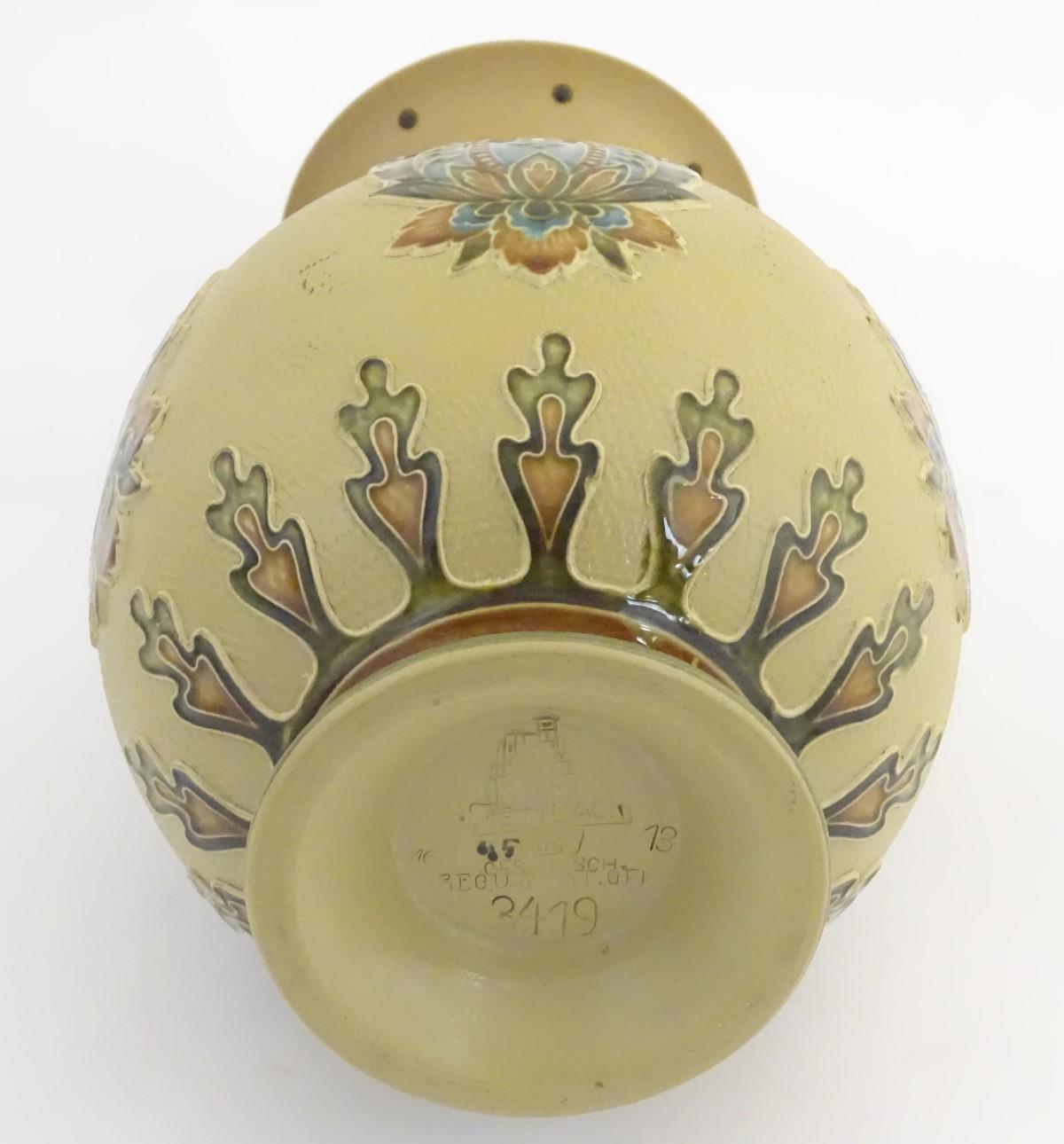 A Mettlach vase with a flared rim and bulbous body, decorated with sylised floral and foliate motifs - Image 13 of 15