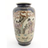 A Japanese vase with panelled decoration depicting figures in a landscape with chickens. Approx.