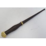 Treen: A 19thC turned wooden staff with a carved marine ivory pommel / finial and banded section.