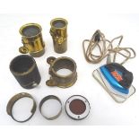 An assortment of early 20thC optical lenses, cased. Together with a boxed 'Clem' travelling iron