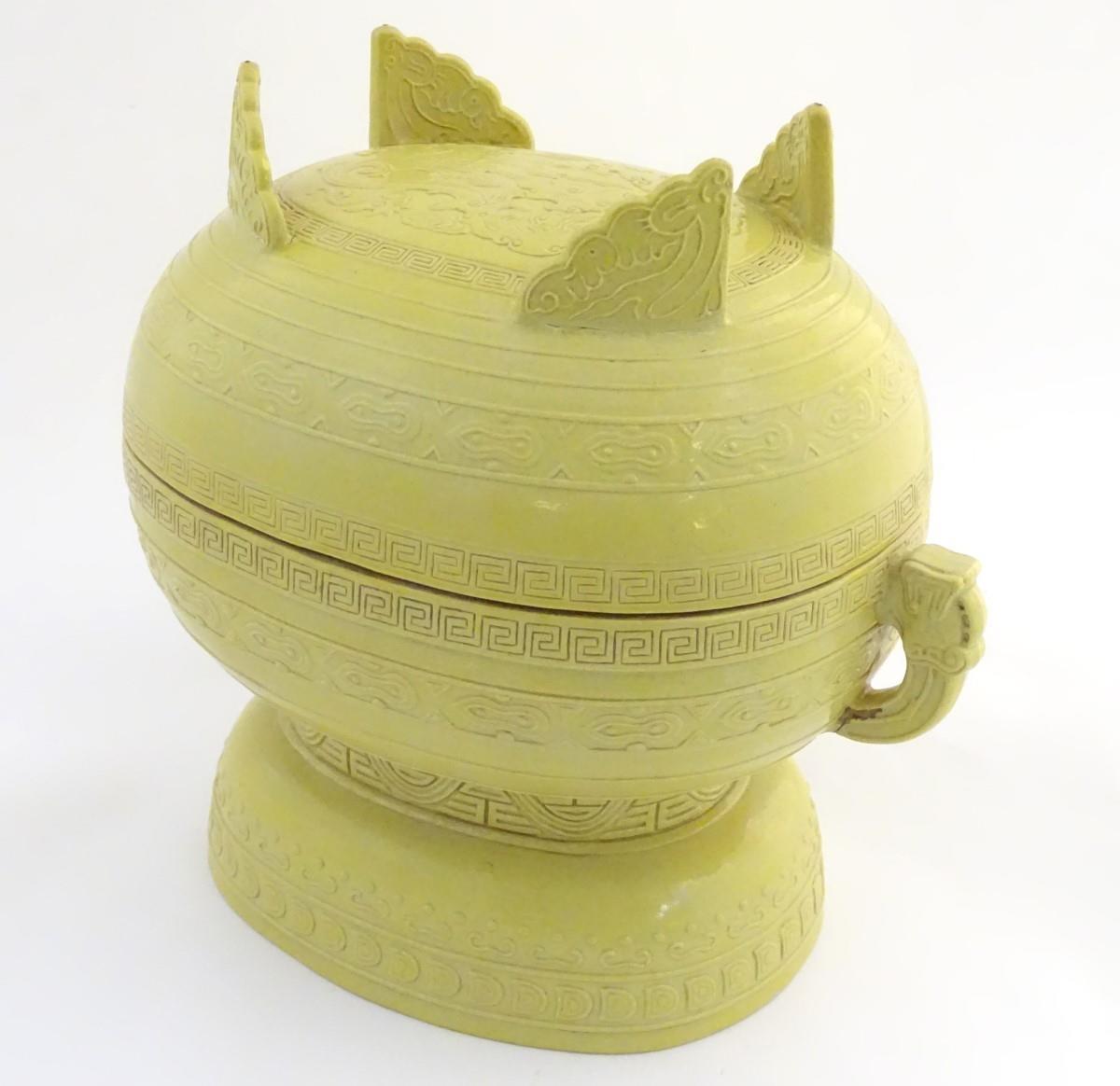 A Chinese yellow ground lidded pot raised on a foot, with twin handles formed as stylised elephant - Image 9 of 32