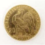 A French Republic 20 franc gold coin, 1911, approx. 6.45g Please Note - we do not make reference