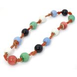 A vintage necklace of ceramic beads. Approx 24'' long Please Note - we do not make reference to