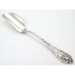 An American sterling silver stilton / cheese scoop decorated with eagle to handle, maker Daniel