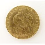 A French Republic 20 franc gold coin, 1907, approx. 6.45g Please Note - we do not make reference