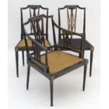 Three Regency chairs of Neo-classical design with ebonised and painted frames, shaped top rails,