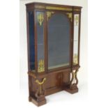 A mid 19thC mahogany vitrine / cabinet in the manner of Henry Dasson with an inverted breakfront