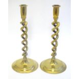 A pair of brass twist stem candlesticks. Approx. 12 1/4" high Please Note - we do not make reference