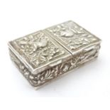 A white metal two section stamp case / pill box with bird and foliate decoration 1 3/4" wide