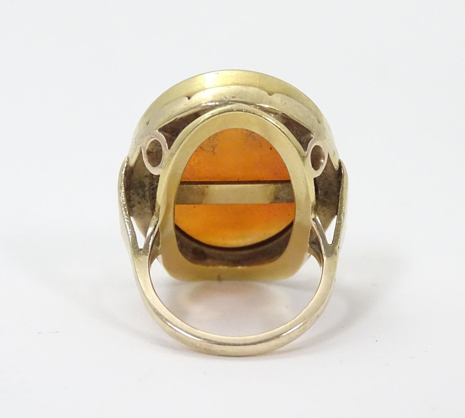 A 9ct gold signet ring set with large carved carnelian seal to centre depicting the personification - Image 13 of 17