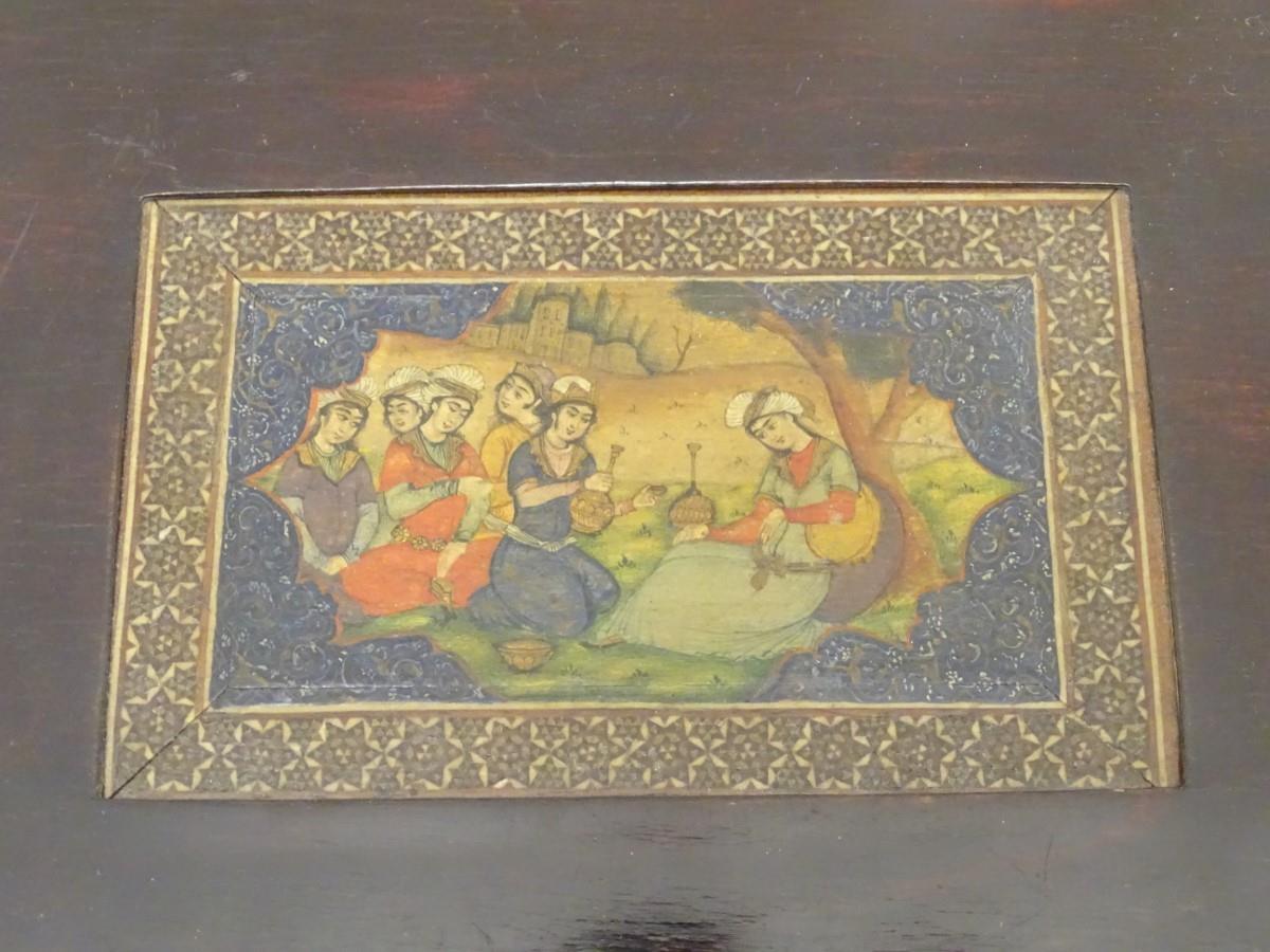 A 19thC Indian painting on a framed sheet bone, depicting a figures seated in a landscape. Approx. 3 - Image 4 of 9