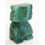 A carved green stone deity figure. Approx. 3 1/4" high Please Note - we do not make reference to the