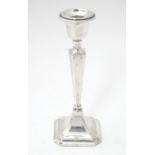 A silver candlestick hallmarked Chester 1917 maker James Deakin & Sons. 7" high Please Note - we
