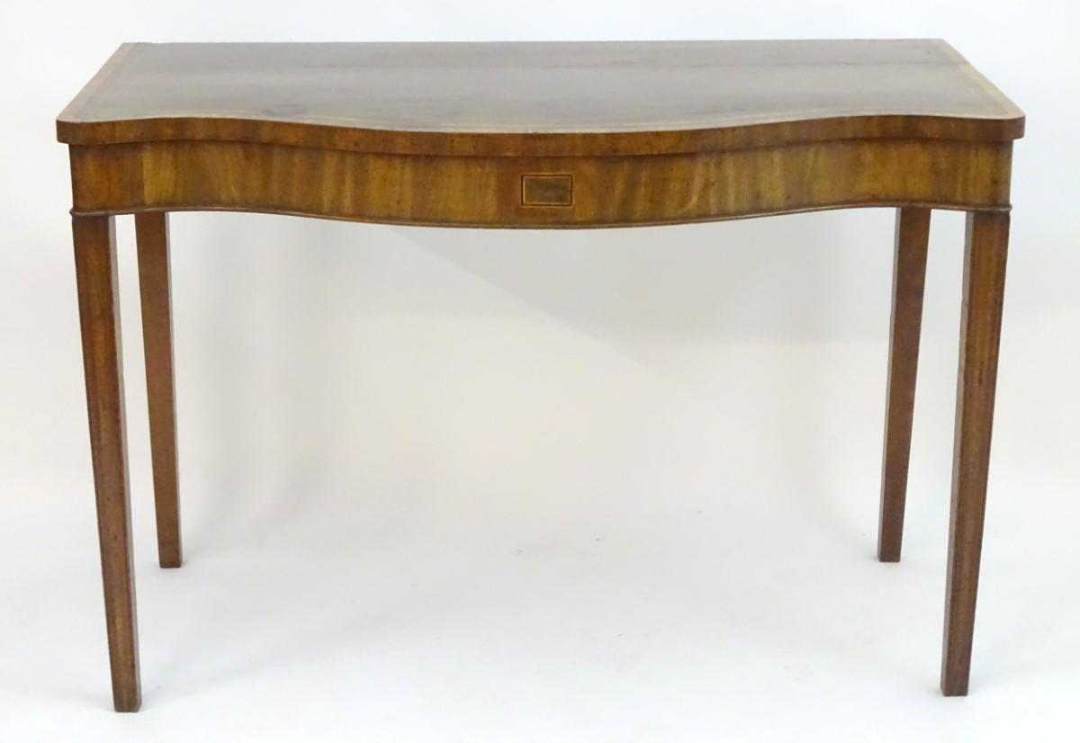 An early 19thC mahogany serving table with a serpentine shaped front, crossbanded top and having - Image 11 of 17
