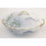 A late 19thC Rosenthal oval scallop shaped tureen with a lobed gilt edged rim, decorated with