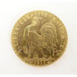 A French Republic 20 franc gold coin, 1911, approx. 6.45g Please Note - we do not make reference