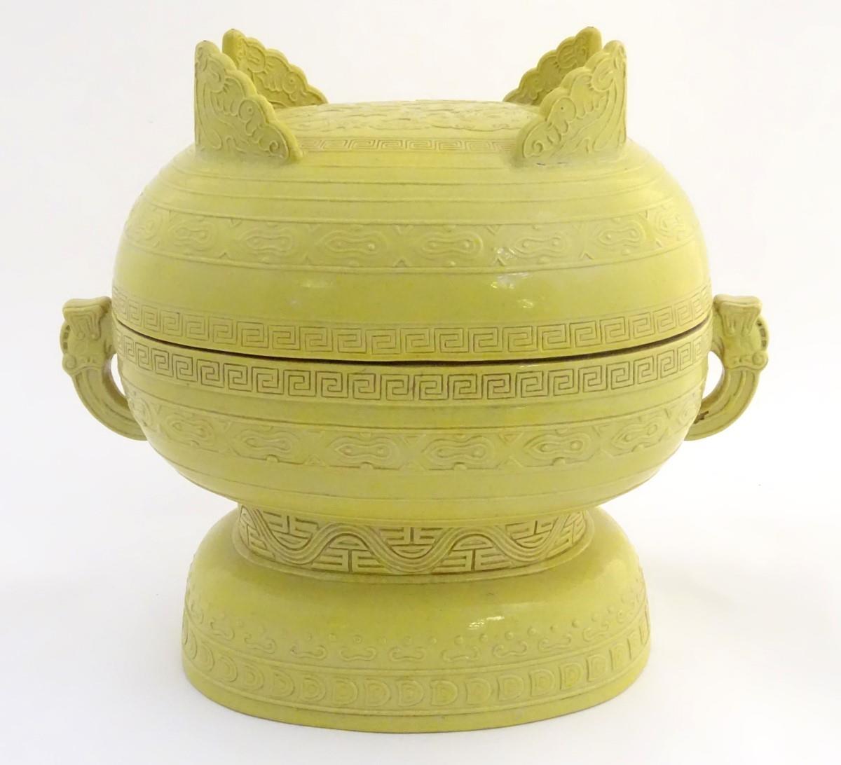 A Chinese yellow ground lidded pot raised on a foot, with twin handles formed as stylised elephant - Image 7 of 32