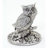 A Silver model of an owl on a naturalistic base. Hallmarked Sheffield 1997 maker Camelot