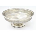 A large silver pedestal bowl with pierced decoration, hallmarked Sheffield 1932, maker Viner Ltd.