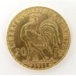 A French Republic 20 franc gold coin, 1911, approx. 6.45g Please Note - we do not make reference